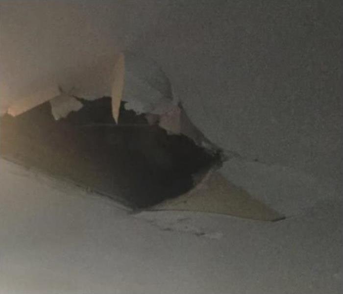 Broken Ceiling From Water Damage